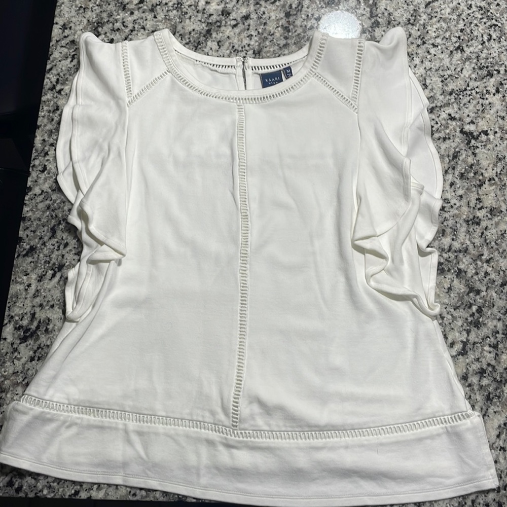 Selling a white blouse, size medium.